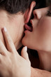 Young adult Caucasian couple in passionate embrace