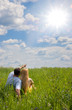 Attractive couple together on meadow in sunny day