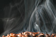 macro coffee beans in aroma smoke