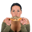 Chubby girl eating a slice of pizza on white background