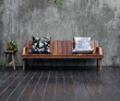Wooden sofa with pillows in a modern interior.