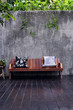 Wooden sofa with pillows in a modern interior.
