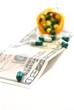 Healthcare, Medicine Costs concept. Pills laying on $50 Bill.