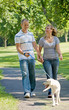 Young Couple Walking Dog Young Couple Walking Dog