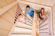 Photo: Happy young family of four at their home Happy young family of four at their home