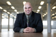 Foto: Portrait of a business man smiling. Portrait of a business man smiling.