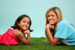 Family Laying Together Outside In The Grass