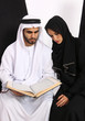 Arabian Couple Reading Islamic Text
