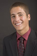 Formal portrait of a teenage boy in a suit and tie.