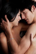 Young adult Caucasian couple in passionate embrace