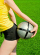 Girl keeping sport ball