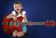 little girl with electric guitar