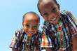 Two boys looking down at the camera