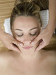 Woman in a day spa getting a deep tissue massage therapy