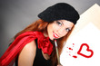 beautiful artist is painting red heart