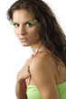 cute girl with artificial green eyelashes and and leaf painted