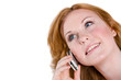 A beautiful woman smiles as she talks on her cellphone