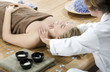 Woman in a day spa getting a deep tissue massage therapy