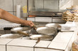 Woman preparing for cooking  in her poor brazilian kitchen