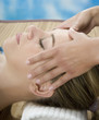 Woman in a day spa getting a deep tissue massage therapy
