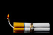 Several cigarettes bound together like sticks of dynamite.