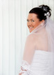 pretty bride standing by the window pretty bride standing by the window