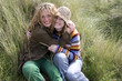 Young women hugging each other in grass