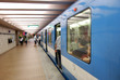 blue subway train in station blue subway train in station