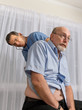 Funny pictuer of senior man reacting to cold stethoscope
