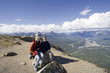 family having a break on the top of a mountain