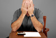 Foto: Man showing signs of stress while working budget Man showing signs of stress while working budget