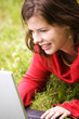 A beautiful student girl working on her laptop