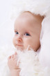 baby among white downy feathers baby among white downy feathers