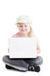 Young girl using a laptop computer over white