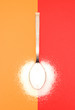 White sugar on silver spoon