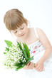 little, pretty girl holding bunch of lilies of the valley little, pretty girl holding bunch of lilies of the valley