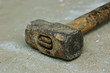 old iron hammer on concrete floor old iron hammer on concrete floor