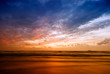 beautiful sunset and waves on the beach