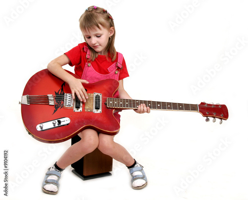 little girl with red guitar
