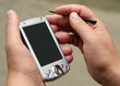 Male hands with stylus and pocket pc