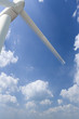 Low angle view of windmill and cloudy sky