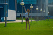 The beauty wet brunette on the grass under the fountain splashes The beauty wet brunette on the grass under the fountain splashes