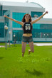 The beauty wet brunette jumps under the fountain splashes The beauty wet brunette jumps under the fountain splashes