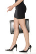 long legs of sensual business woman with black suitcase