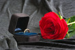 Wedding ring and red rose on velvet background Wedding ring and red rose on velvet background
