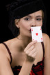 Attractive blond woman kissing the back of an ace of hearts Attractive blond woman kissing the back of an ace of hearts