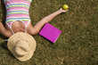 a student relaxing at the grass of the school park a student relaxing at the grass of the school park