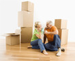 Photo: Couple with moving boxes. Couple with moving boxes.