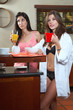 Sexy young adult brunette roommates in lingerie eating