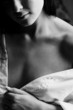 Young adult Caucasian woman in a white shirt and lingerie